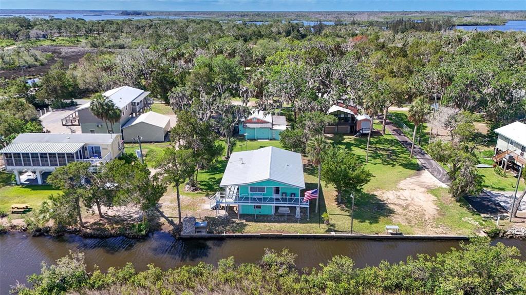 2220 Coon Point Crystal River, FL 34429 - Photo 45 of 58 an aerial view of a house with a lake view