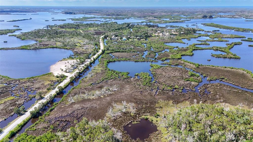 2220 Coon Point Crystal River, FL 34429 - Photo 55 of 58 an aerial view of a house with a yard