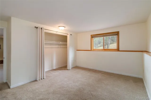 a view of a patio with table and chairs with wooden floor and fence