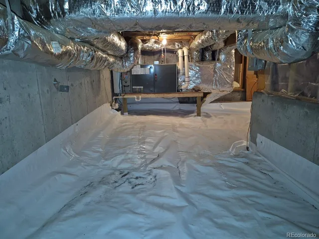 a room with pool table and windows