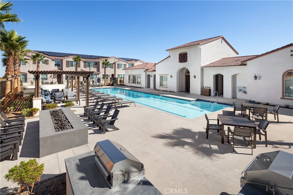 24931 Padre Court Wildomar, CA 92595 - Photo 21 of 24 a view of a patio with couches table and chairs and potted plants