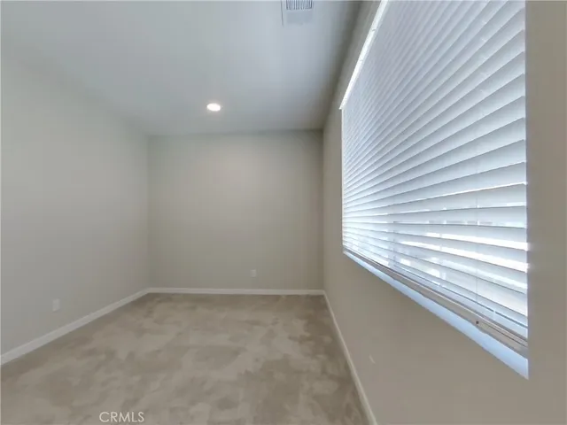 a bathroom with a shower sink and mirror