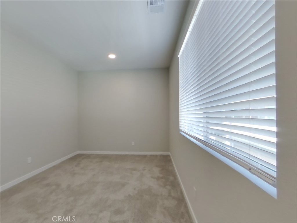 24931 Padre Court Wildomar, CA 92595 - Photo 7 of 24 a view of an empty room with a window