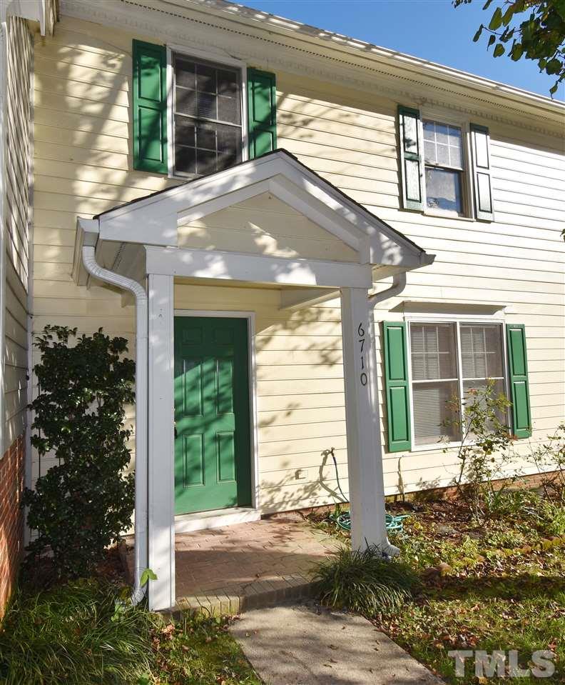 6710 Twin Tree Court Raleigh, NC 27613 - Photo 1 of 18 a front view of a house with a yard