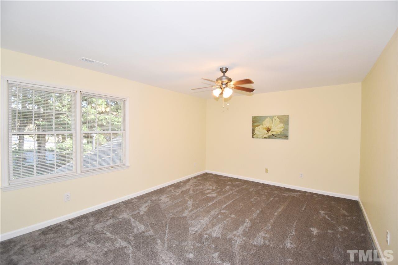 6710 Twin Tree Court Raleigh, NC 27613 - Photo 13 of 18 en view of an empty room with a window