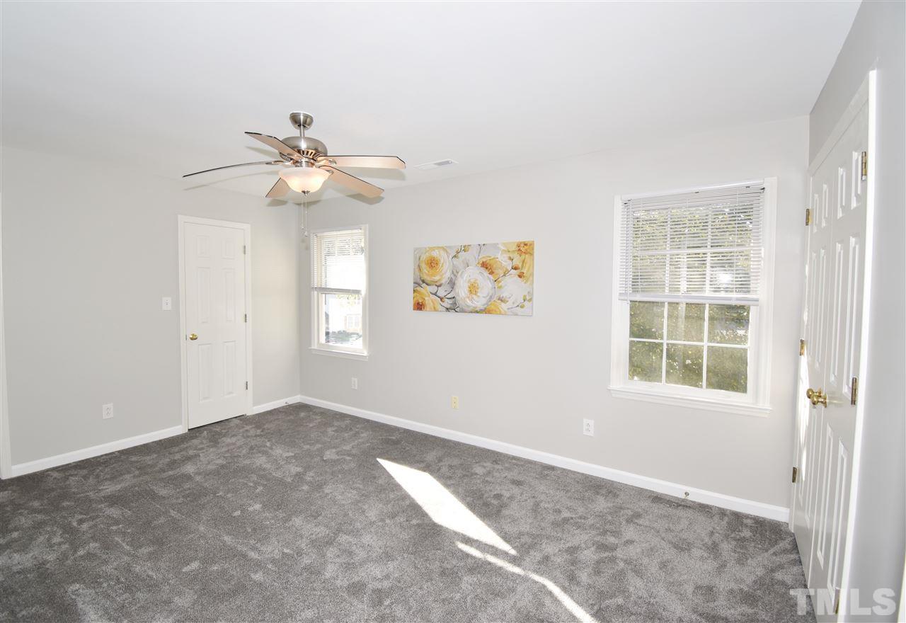 6710 Twin Tree Court Raleigh, NC 27613 - Photo 15 of 18 an empty room with windows and fan