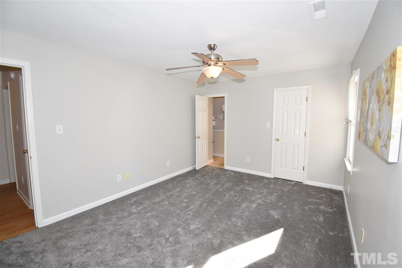 6710 Twin Tree Court Raleigh, NC 27613 - Photo 16 of 18 a view of empty room with ceiling fan