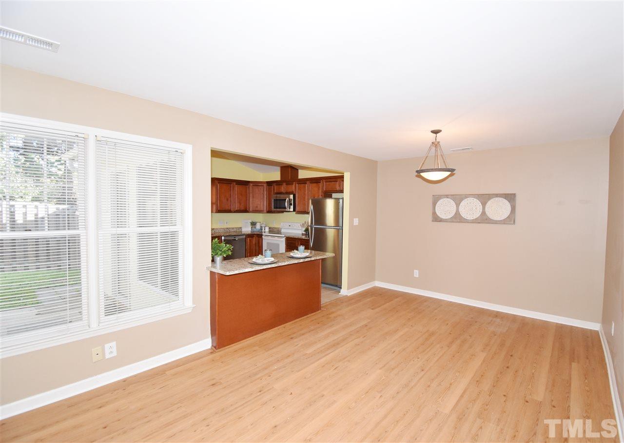 6710 Twin Tree Court Raleigh, NC 27613 - Photo 7 of 18 a view of a room with wooden floor and a window