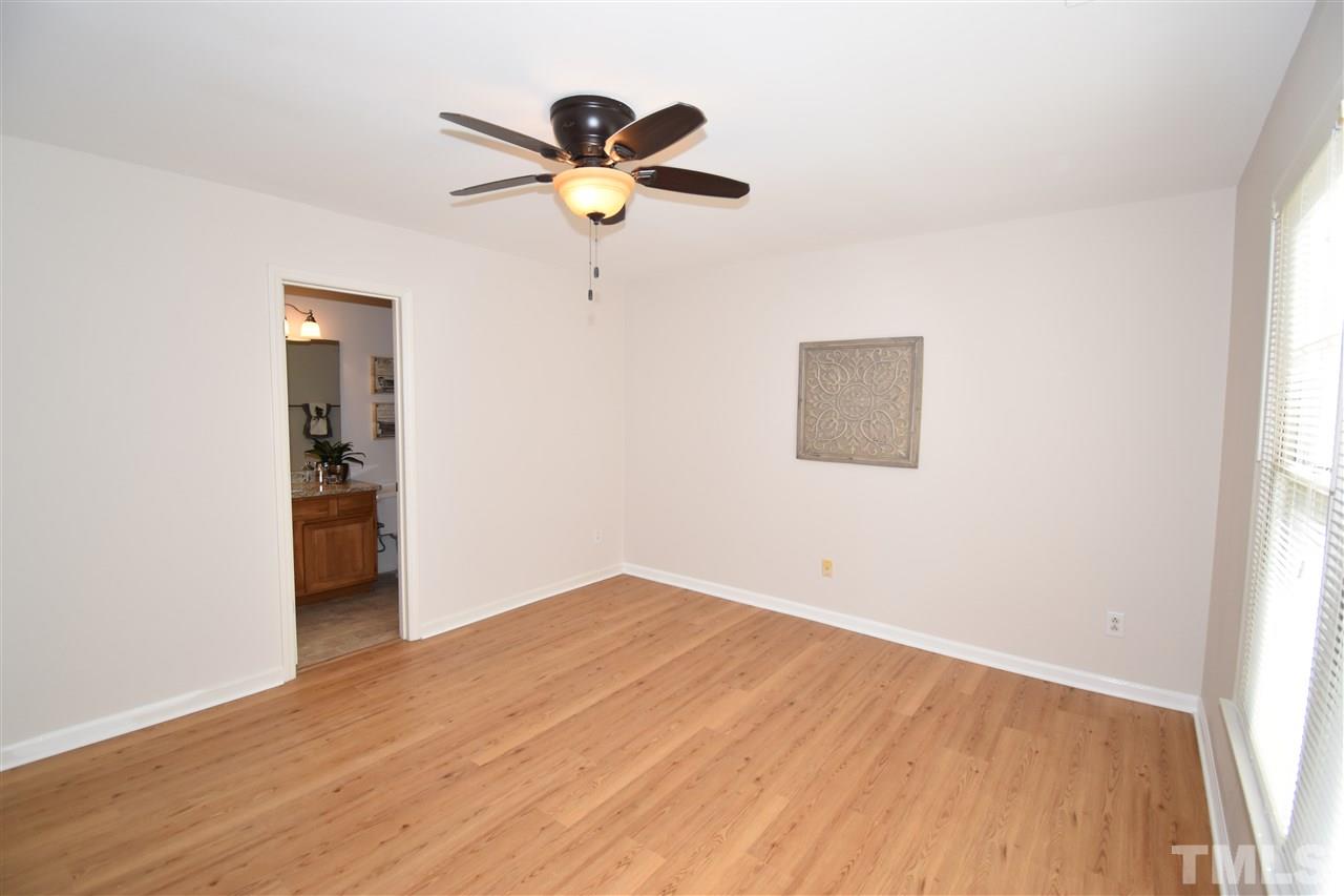 6710 Twin Tree Court Raleigh, NC 27613 - Photo 10 of 18 a view of empty room with wooden floor