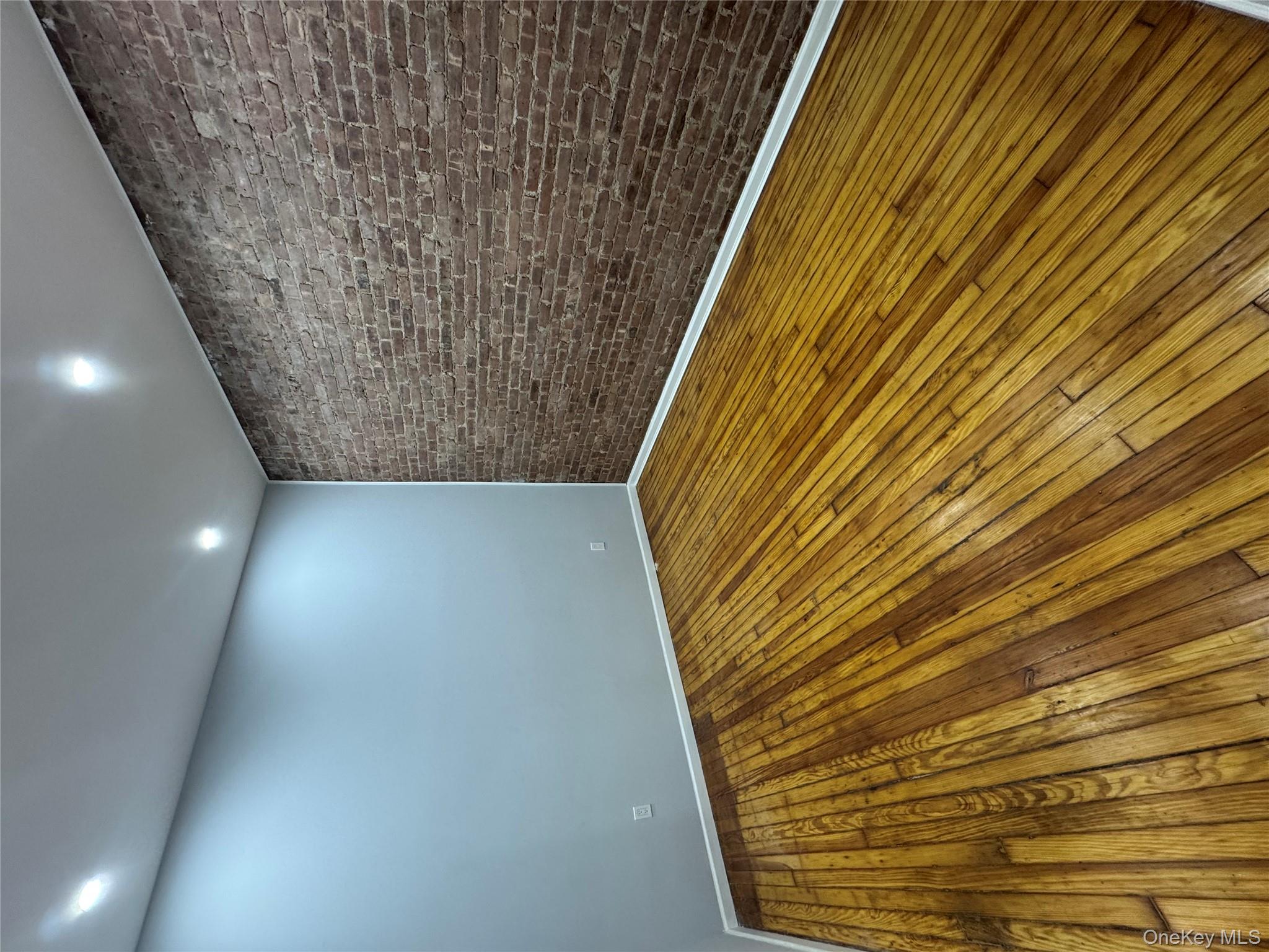 299 Malcolm X Boulevard Brooklyn, NY 11233 - Photo 3 of 9 a view of wooden floor