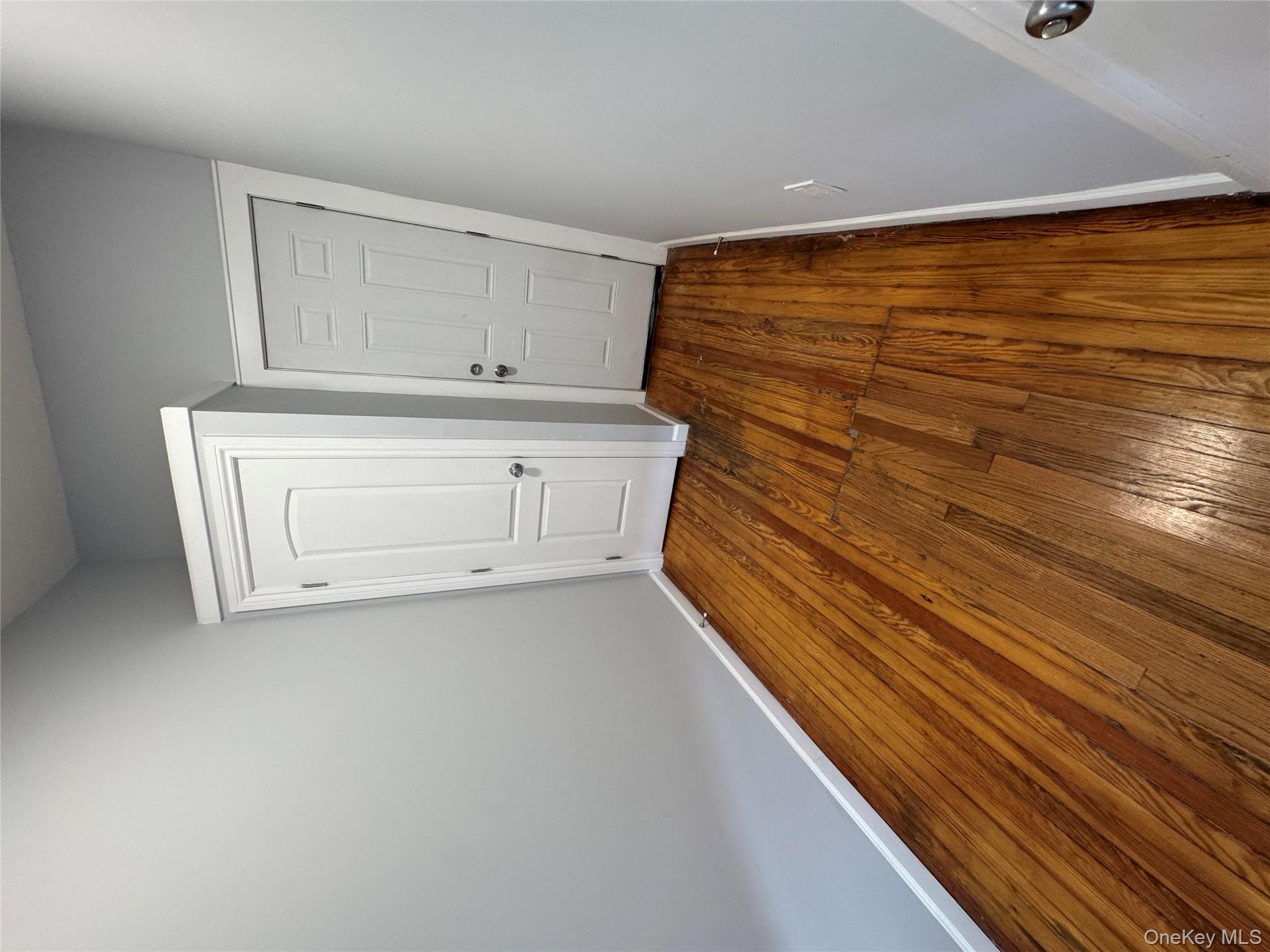 299 Malcolm X Boulevard Brooklyn, NY 11233 - Photo 8 of 9 a view of wooden floor in a room