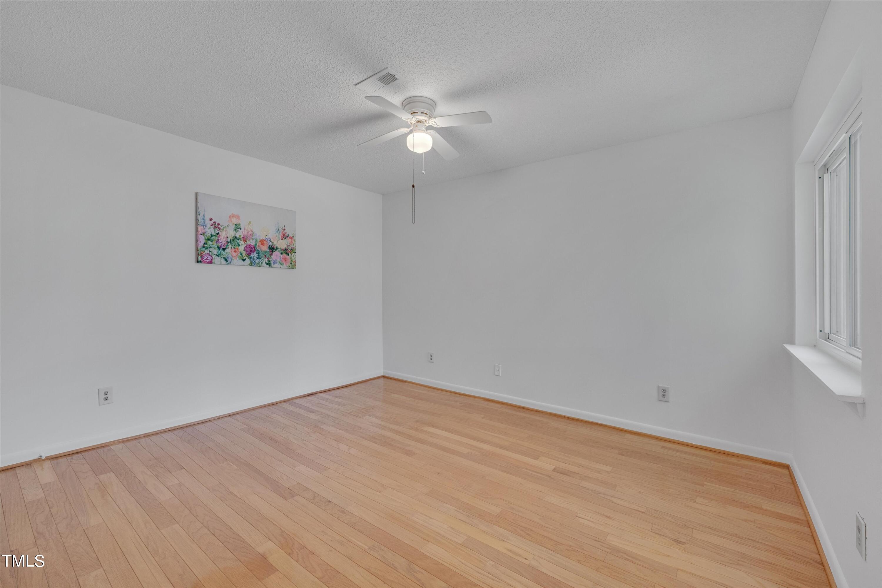 617 Pine Ridge Place Raleigh, NC 27609 - Photo 15 of 18 wooden floor in an empty room