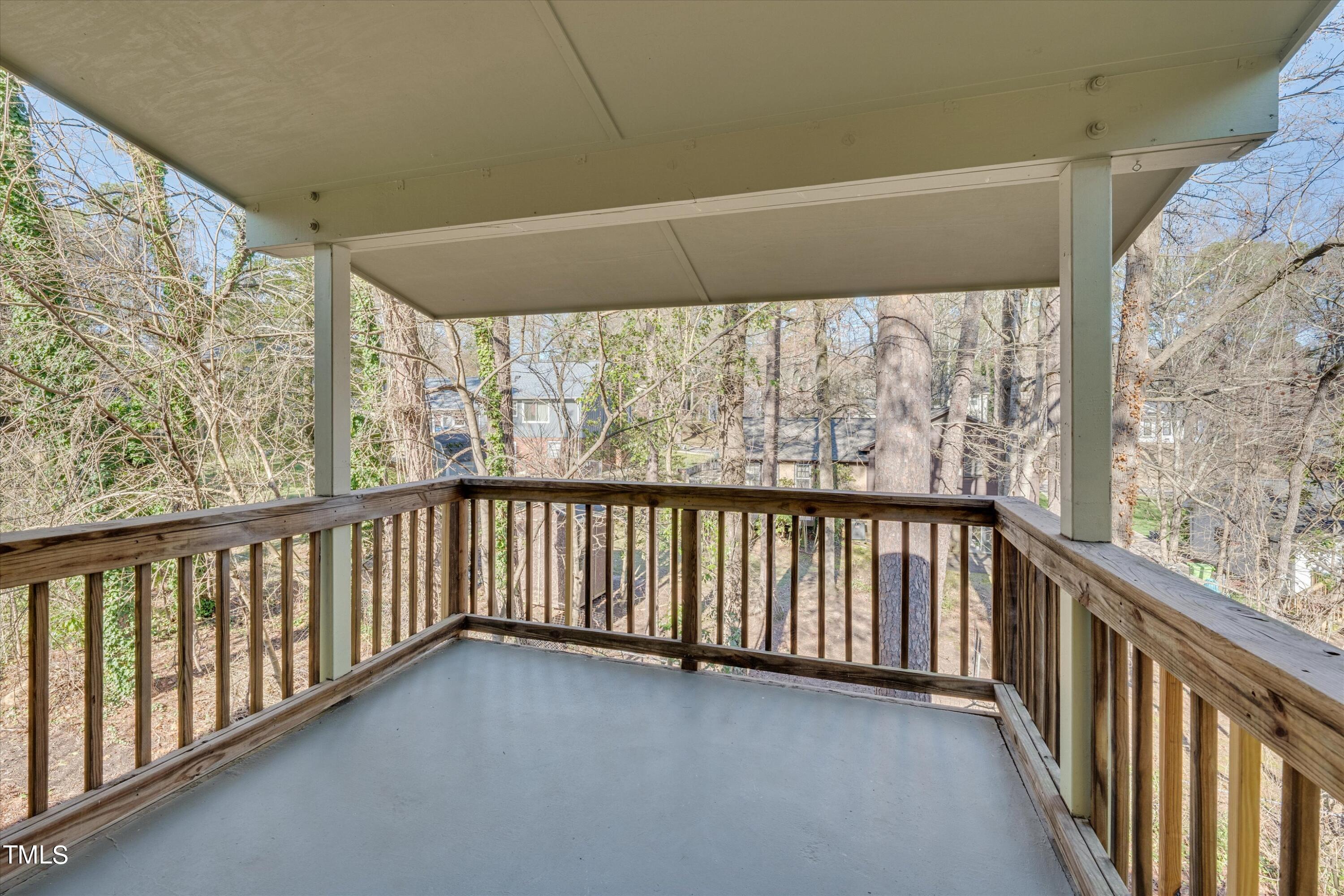617 Pine Ridge Place Raleigh, NC 27609 - Photo 16 of 18 a view of a balcony with wooden floor