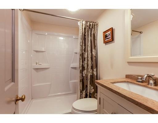 238 Hale Street Beverly, MA 01915 - Photo 13 of 30 a bathroom with a sink toilet a mirror and shower