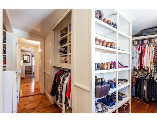 238 Hale Street Beverly, MA 01915 - Photo 17 of 30 a view of walk in closet with clothes and shoes