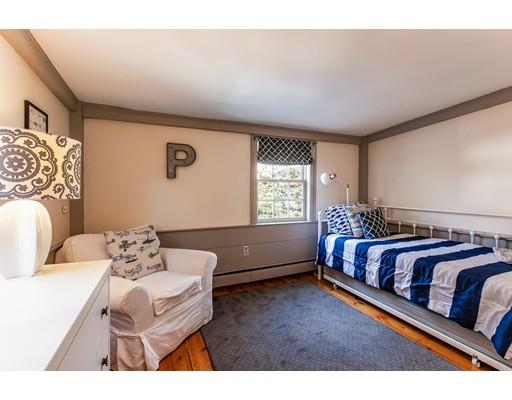 238 Hale Street Beverly, MA 01915 - Photo 20 of 30 a bedroom with a bed and a couch