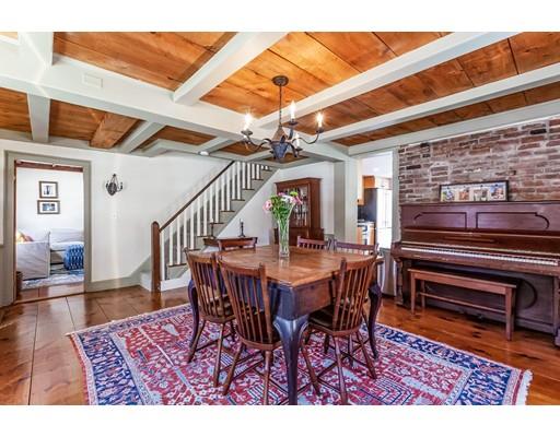 238 Hale Street Beverly, MA 01915 - Photo 9 of 30 a dining room with a wooden table and chairs