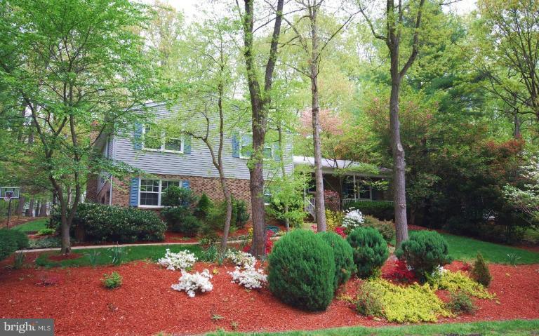 10728 Midsummer Drive Reston, VA 20191 - Photo 1 of 21 a view of a house with a yard and garden