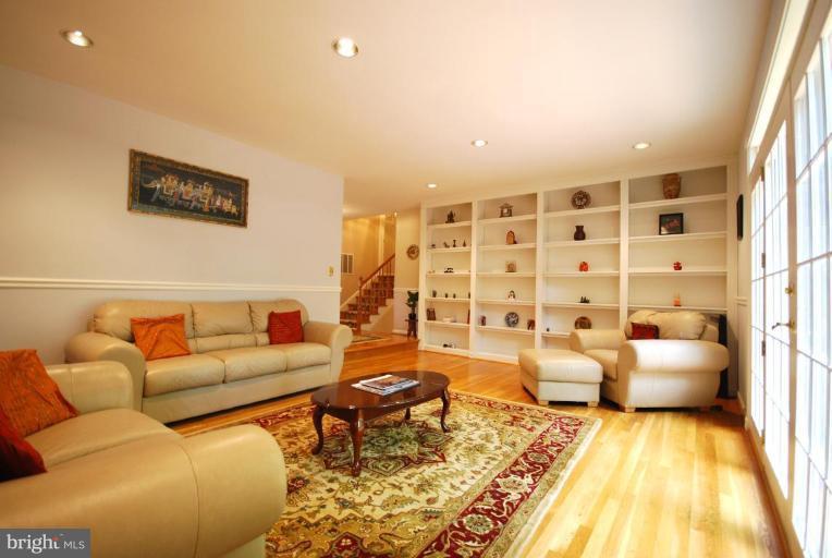10728 Midsummer Drive Reston, VA 20191 - Photo 11 of 21 a living room with furniture and a rug