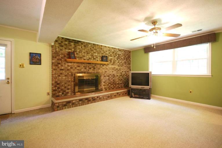10728 Midsummer Drive Reston, VA 20191 - Photo 12 of 21 a living room with a fireplace