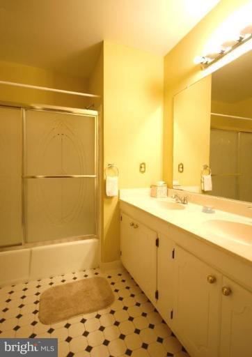 10728 Midsummer Drive Reston, VA 20191 - Photo 20 of 21 a bathroom with a shower and a sink