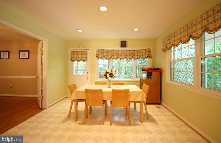 10728 Midsummer Drive Reston, VA 20191 - Photo 9 of 21 a view of a dining room with furniture window and wooden floor