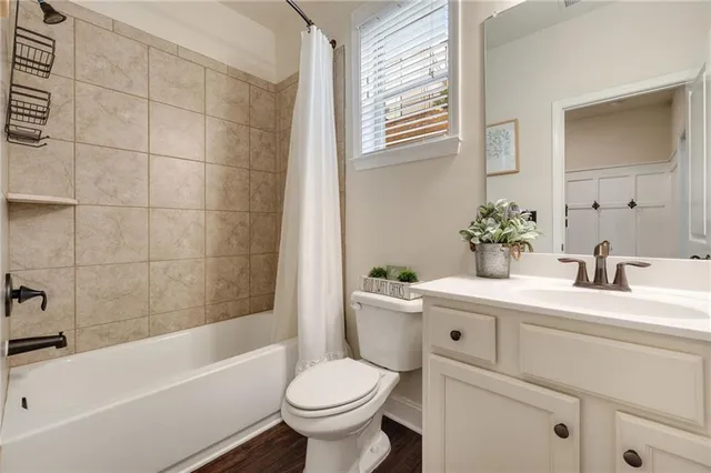 a bathroom with a sink toilet and bathtub