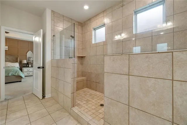 a bathroom with a glass shower door
