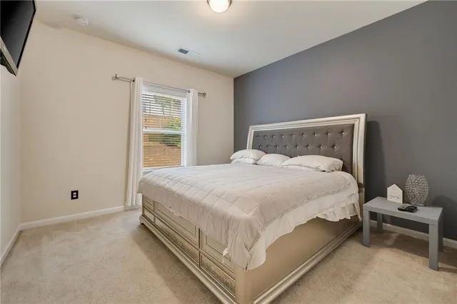 a bed room with a bed and a window