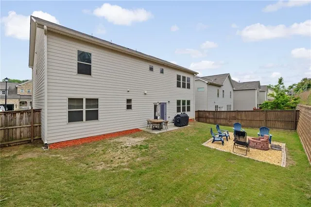 a view of a patio with chair and tables
