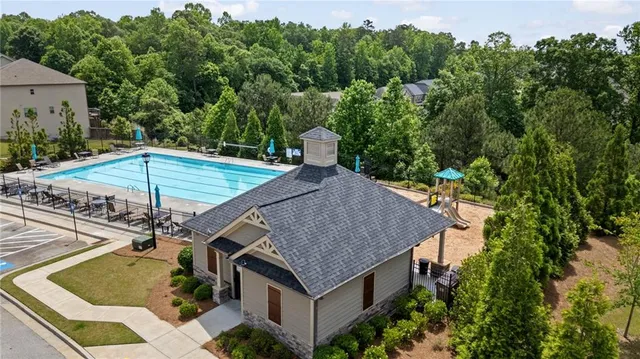 an aerial view of a house with outdoor space