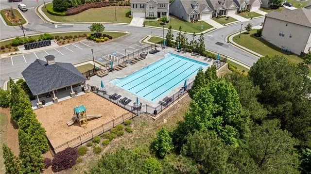 an aerial view of a house with outdoor space