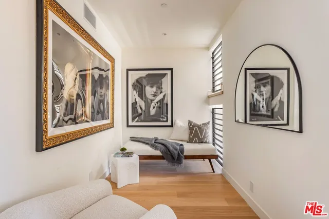 a living room with furniture and a painting