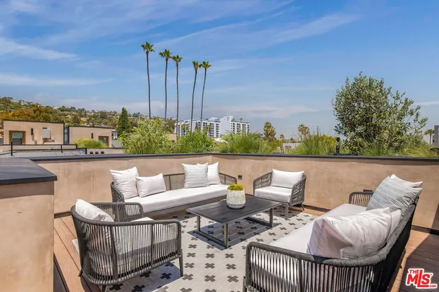 a patio with patio a couch and chairs