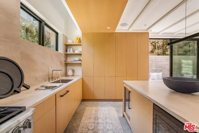 a kitchen that has a sink and a stove