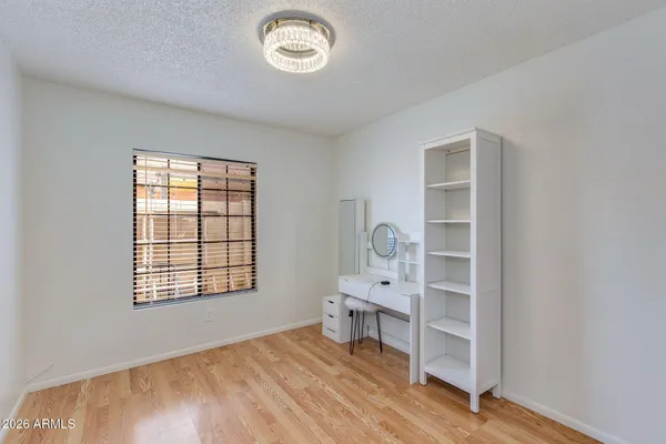 a view of a backyard with plants and a patio