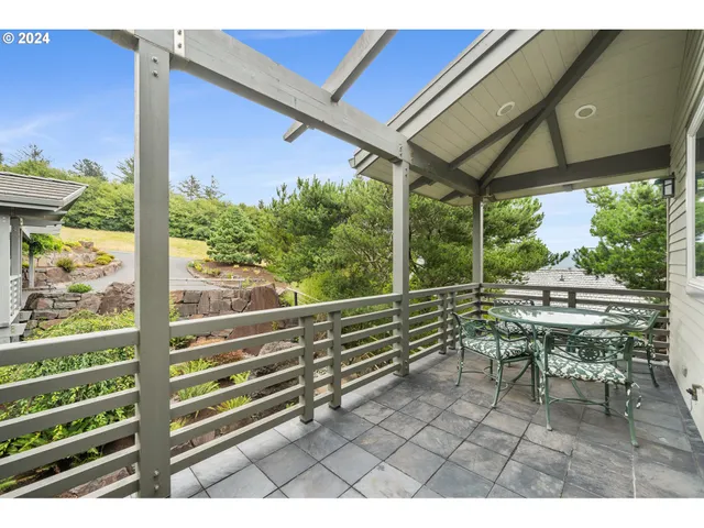 a view of a chairs and table in the patio