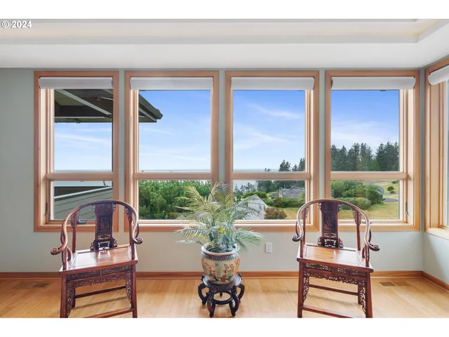 a view of a living room and floor to ceiling window