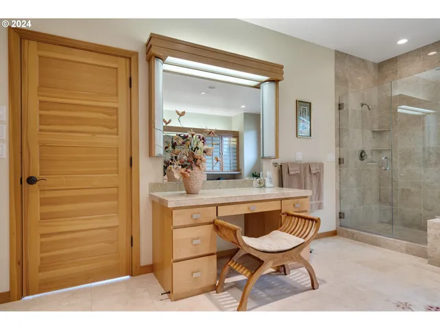 a view of a bathroom with a sink and a mirror
