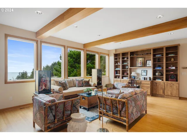 a living room with furniture large window and outer view