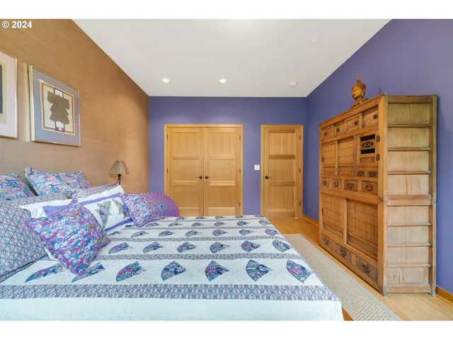 a bedroom with a bed and a walk in closet