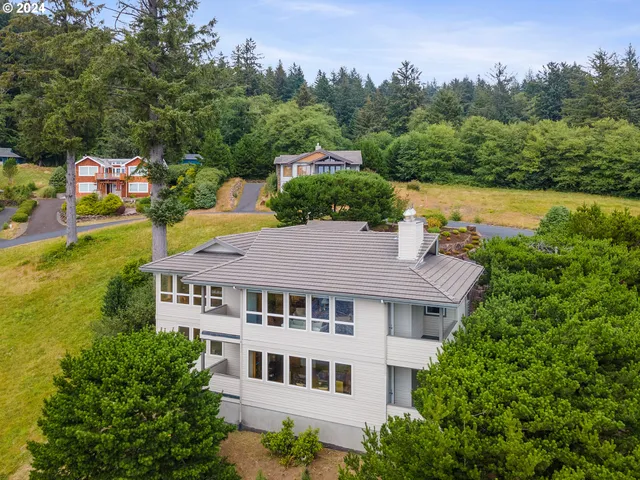an aerial view of a house with a garden