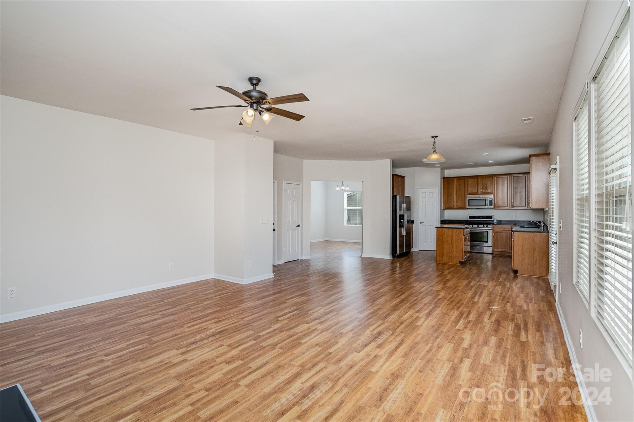 7006 Farm Pond Road Indian Trail, NC 28079 - Photo 11 of 37 a view of a kitchen with wooden floor and a kitchen