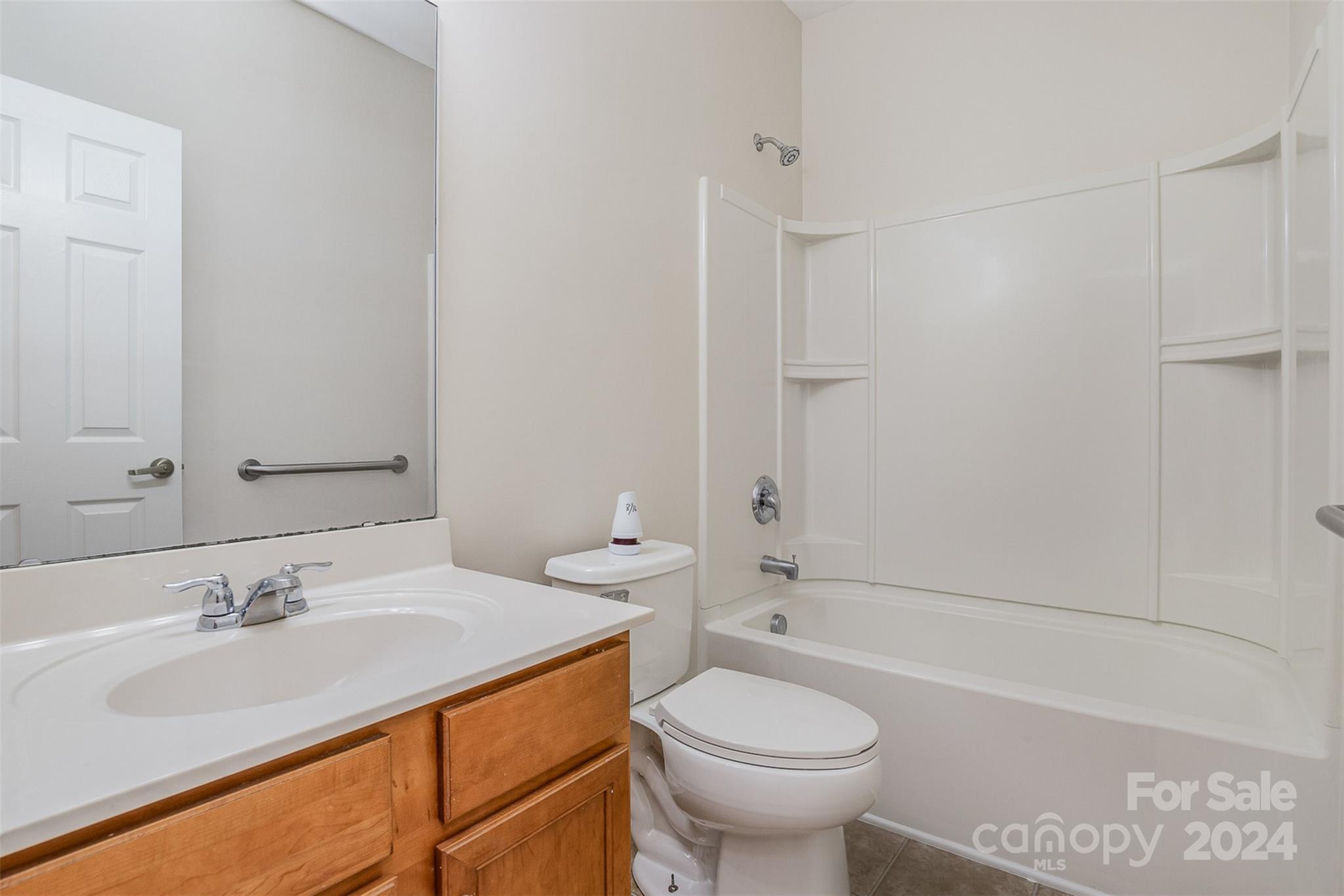 7006 Farm Pond Road Indian Trail, NC 28079 - Photo 12 of 37 a bathroom with a sink toilet vanity and shower
