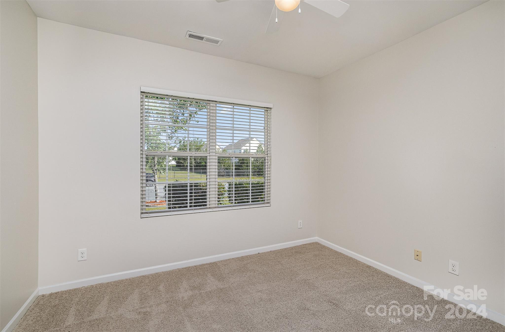 7006 Farm Pond Road Indian Trail, NC 28079 - Photo 13 of 37 an empty room with a window