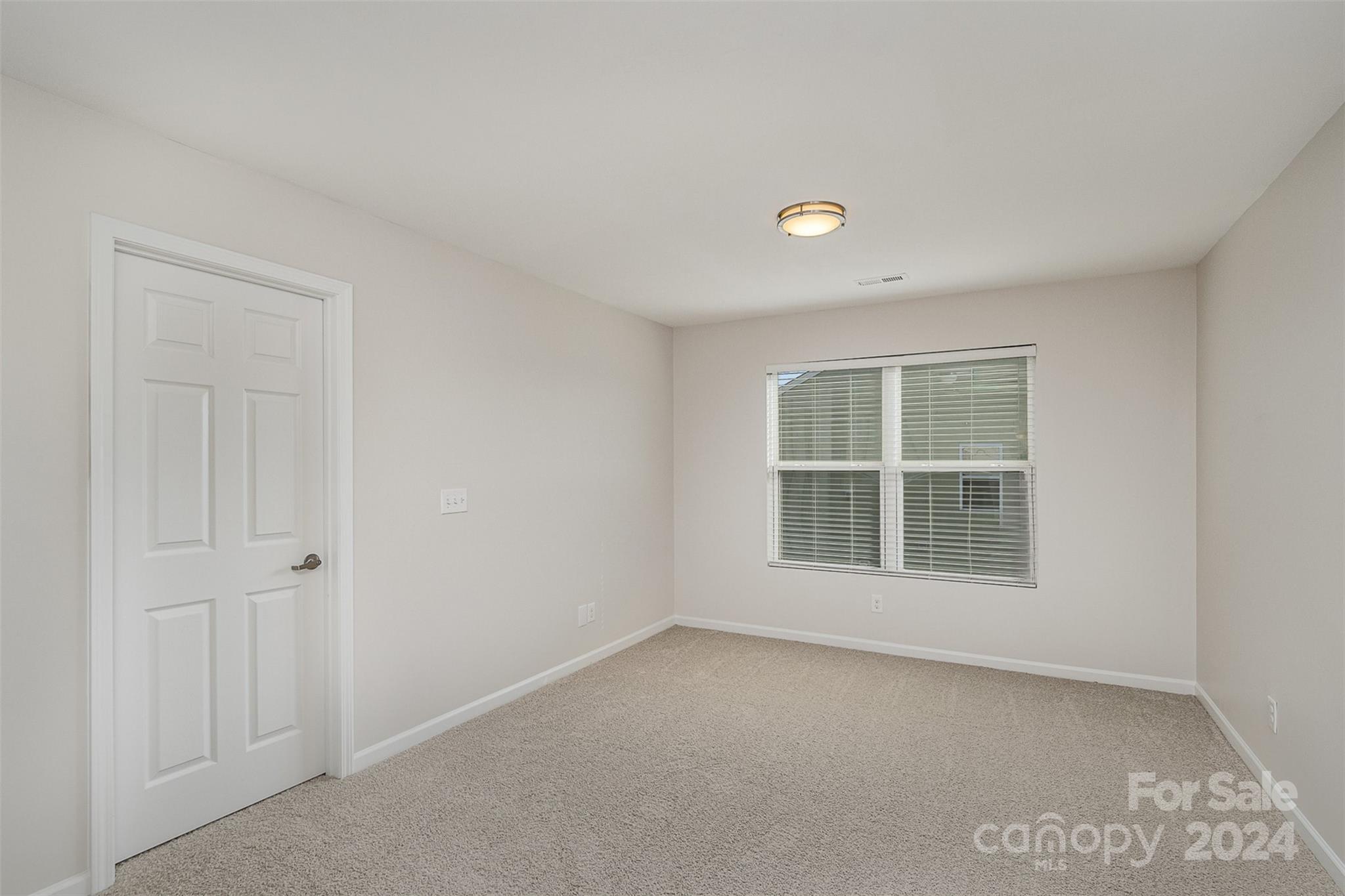 7006 Farm Pond Road Indian Trail, NC 28079 - Photo 15 of 37 a view of an empty room with a window