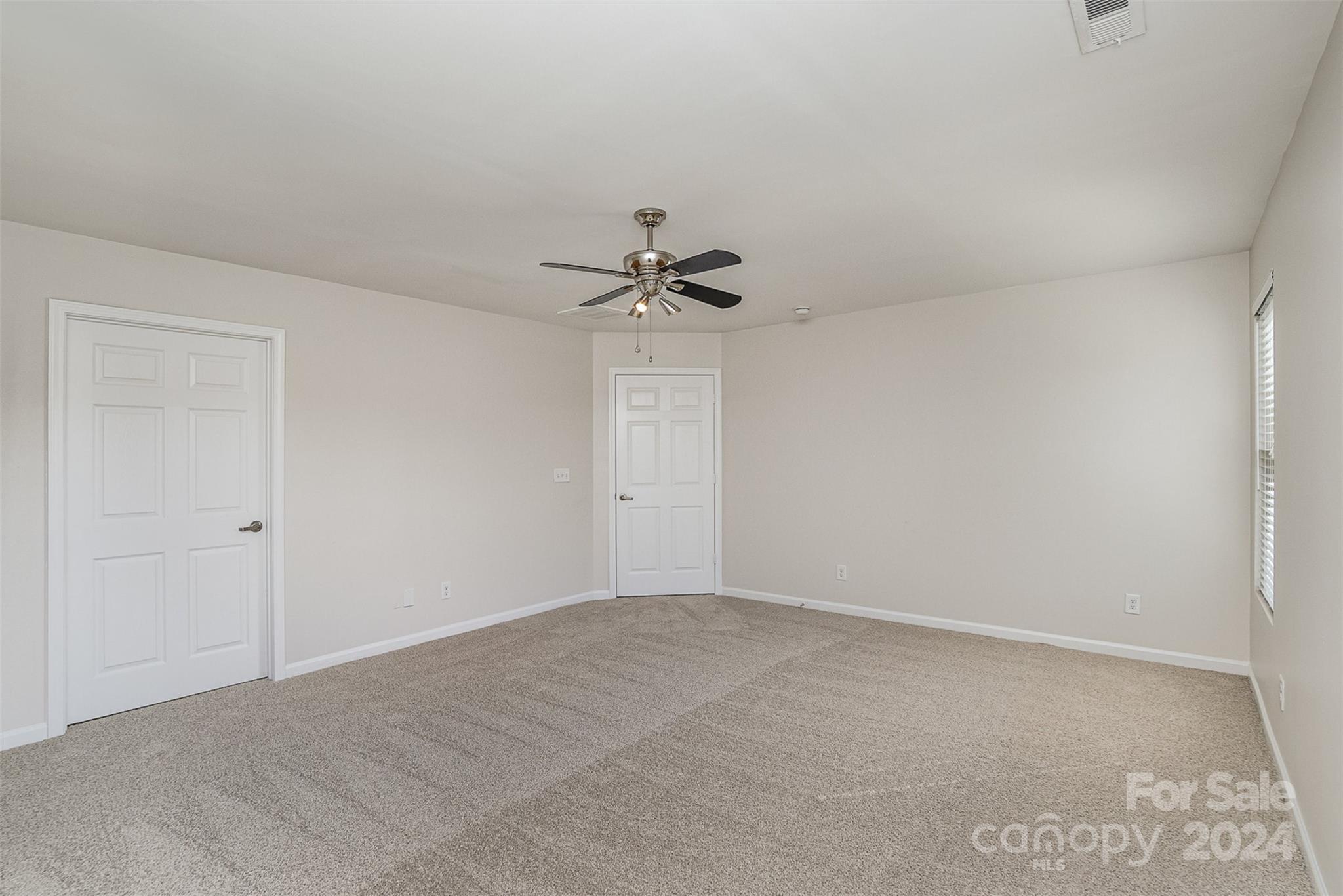 7006 Farm Pond Road Indian Trail, NC 28079 - Photo 18 of 37 a view of a room with a ceiling fan