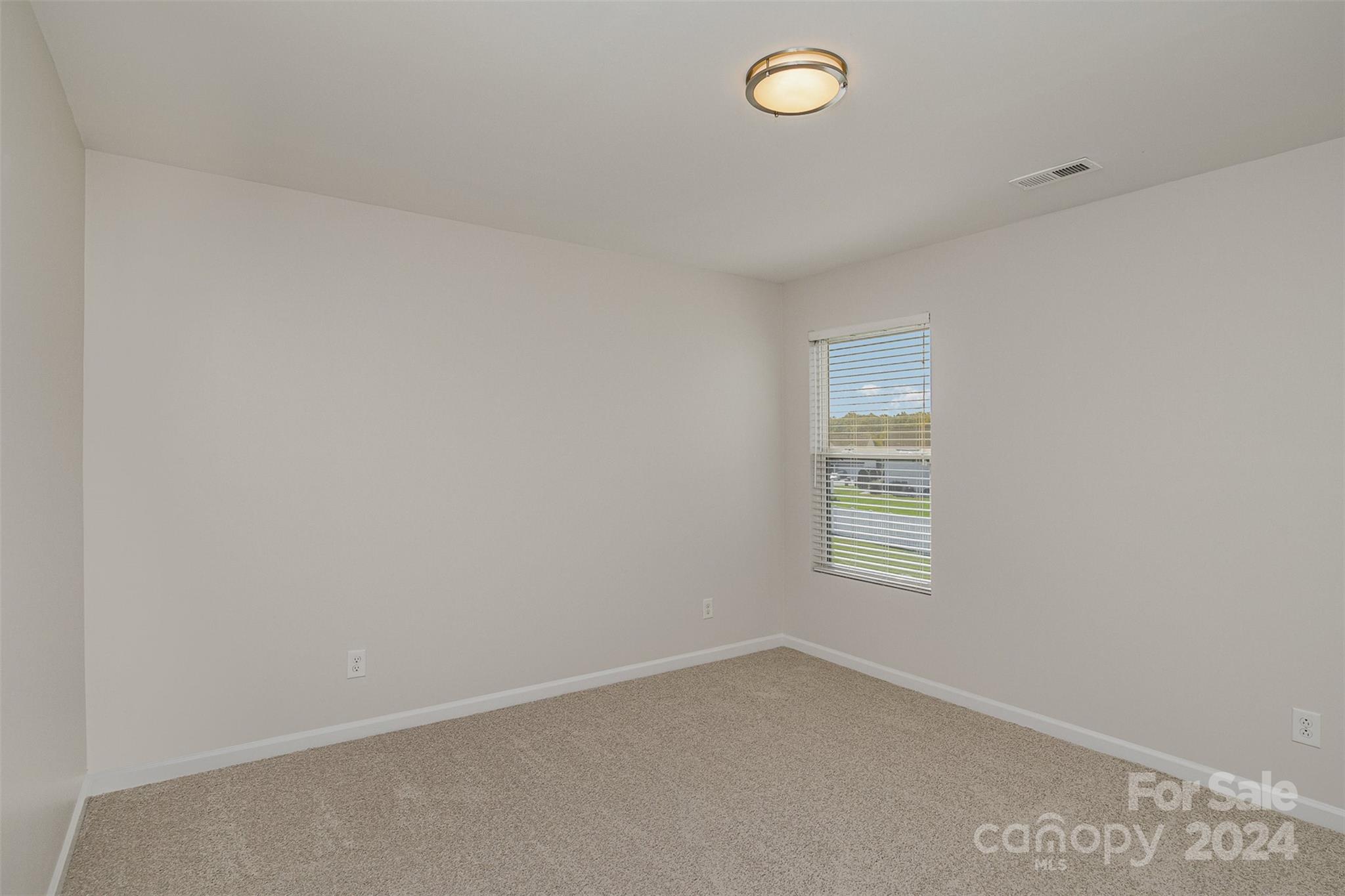 7006 Farm Pond Road Indian Trail, NC 28079 - Photo 22 of 37 an empty room with a window