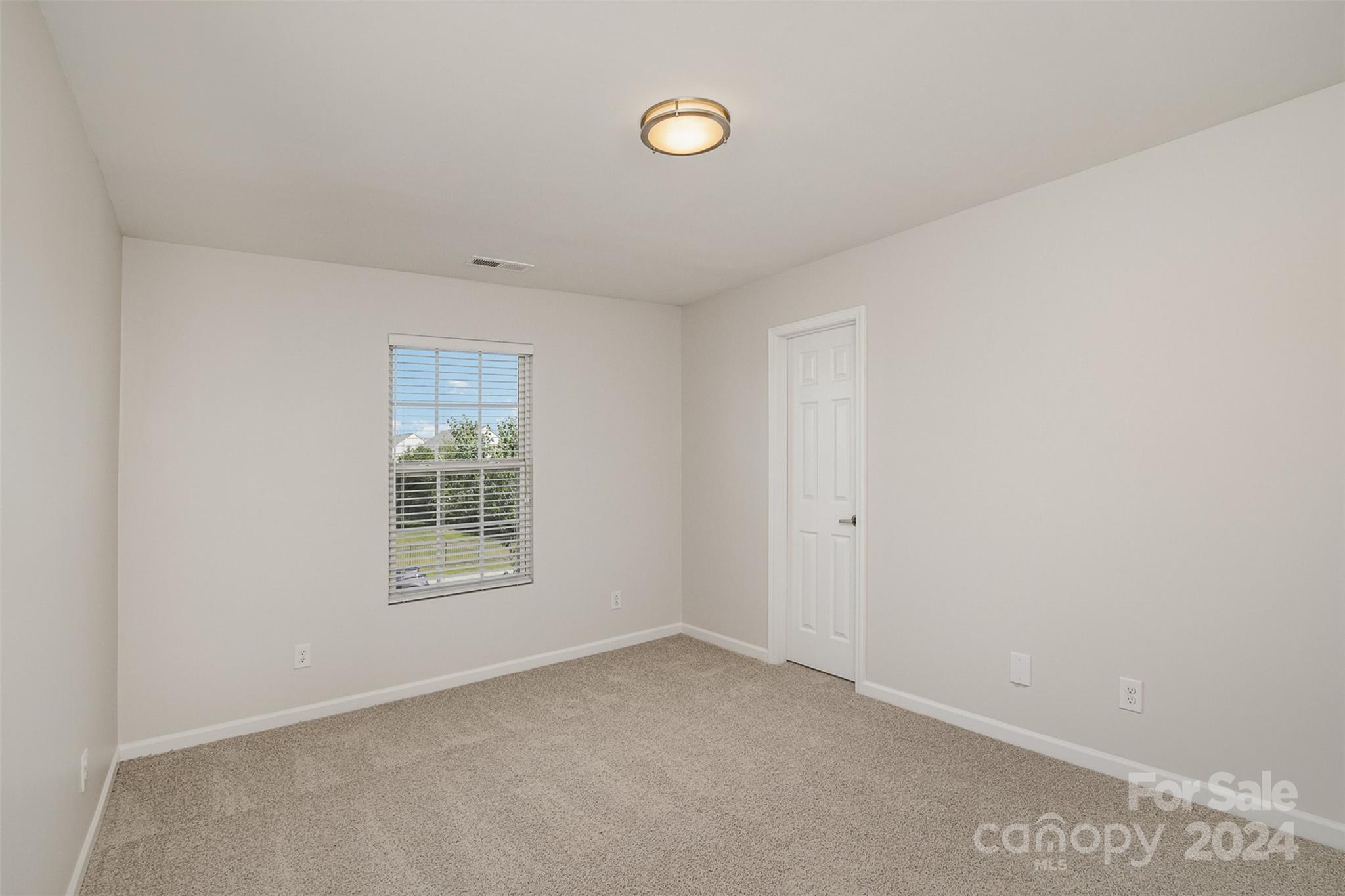 7006 Farm Pond Road Indian Trail, NC 28079 - Photo 24 of 37 a view of an empty room with a window