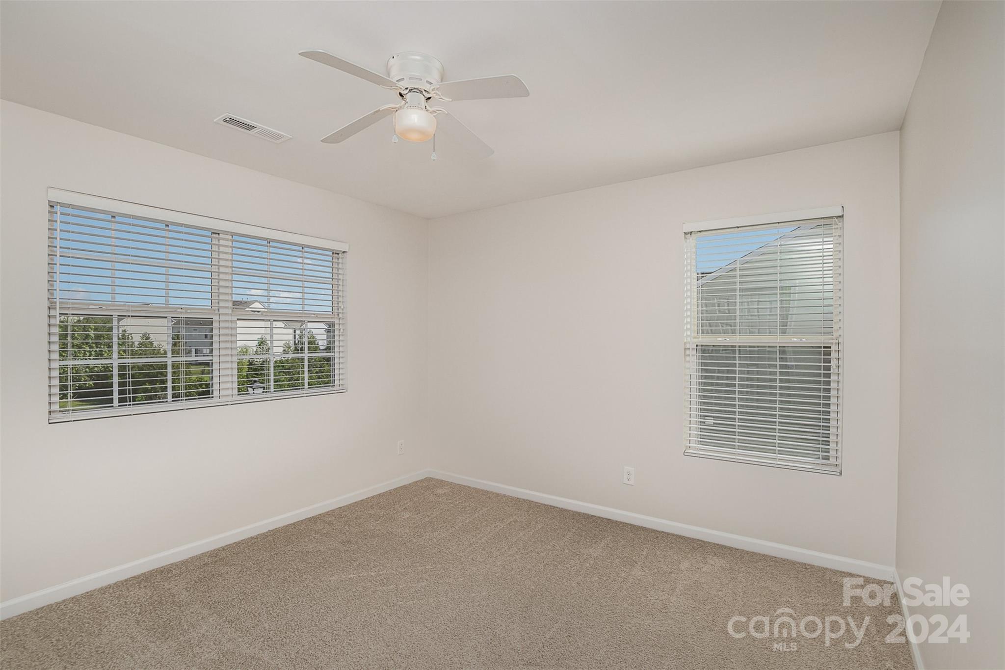 7006 Farm Pond Road Indian Trail, NC 28079 - Photo 27 of 37 an empty room with a window